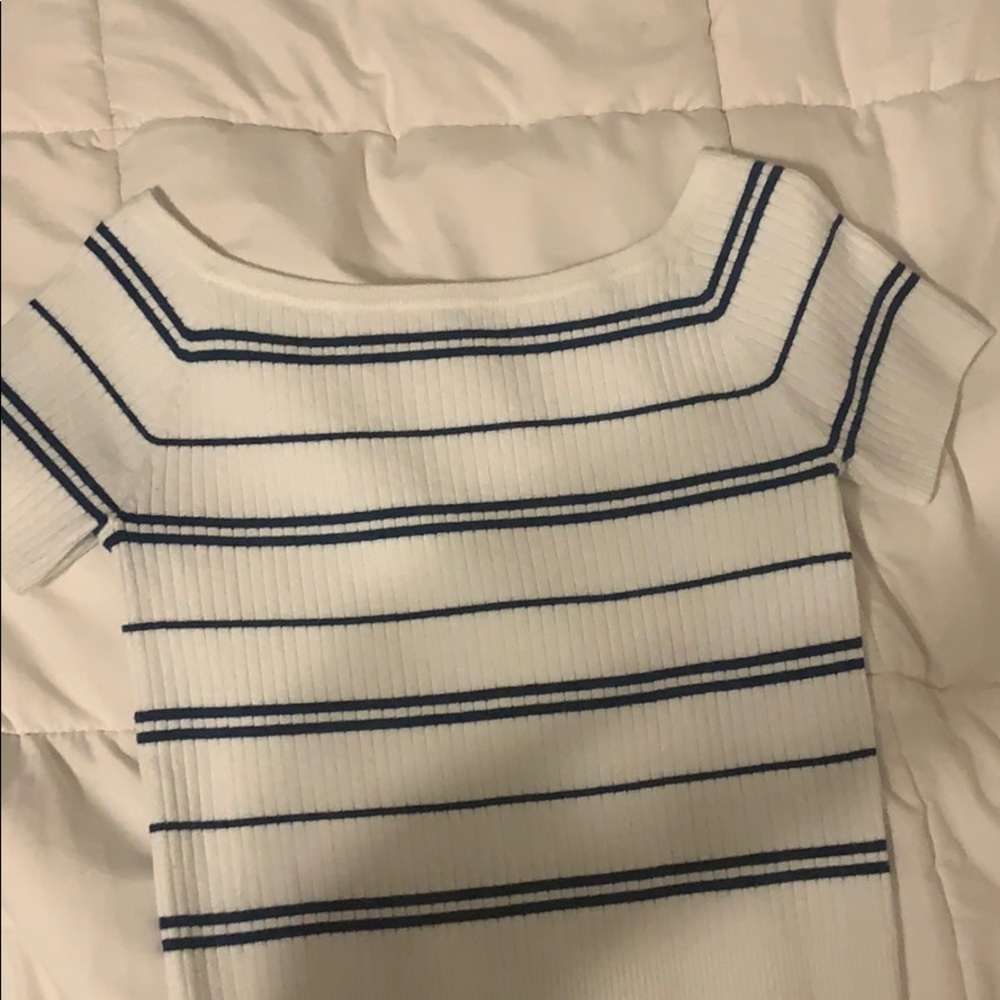 A white and navy blue crop top.